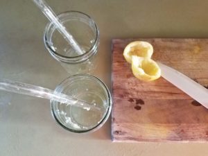 Squeeze lemon into glass